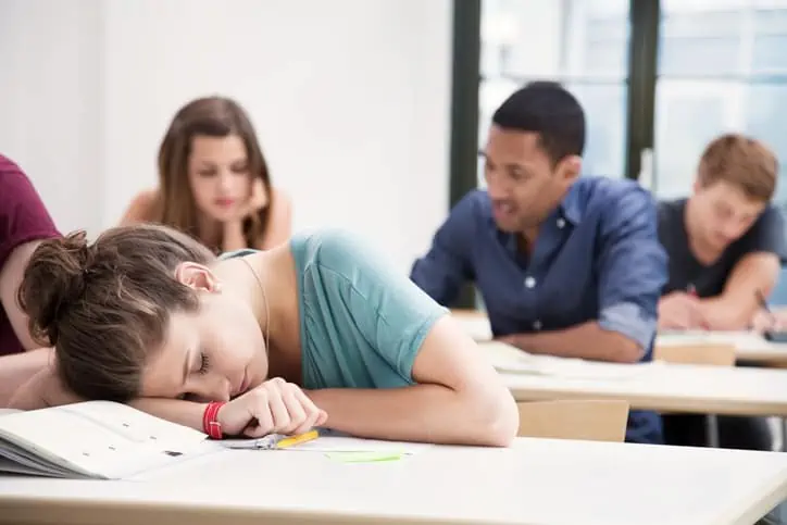 women sleeping in class