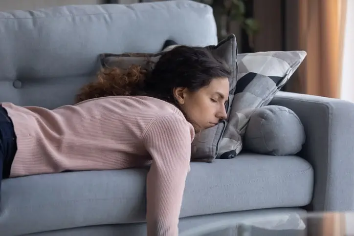 women sleeping on couch