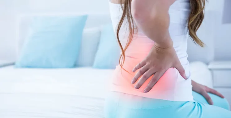 spine of woman with back pain at home